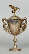 A 19th century Chinese unmarked silver trophy cup and cover The removable domed lid surmounted