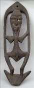 A New Guinea suspension hook, middle Sepik Kanganaman carved blackened wood with shell eyes And