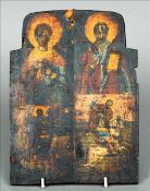 A painted wooden icon, possibly 18th century, Russian Decorated with four various saints. 25.5 cms
