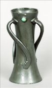 An Arts & Crafts Tudric patinated pewter vase The waisted cylindrical body with three scrolling