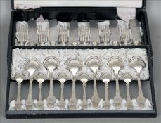 A canteen of Austrian silver plated cutlery Each piece with scroll cast handles with engraved