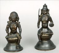 Two 19th century Indian patinated bronze models of deities Each modelled seated on a domed base. The