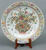 A 19th century Chinese enamel decorated charger The floral border above a band of lappet
