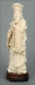 A large 19th century Chinese carved ivory figure Modelled as a bearded gentleman wearing a crown and