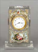 An enamel decorated crystal mantel clock The facet cut body centred with a circular white enamel