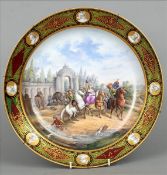 A Meissen charger The gilt detailed border set with classical busts, the main body decorated with
