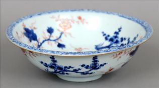 An Eastern porcelain wash bowl Decorated in the Imari palette. 28 cms diameter. Two hairline cracks,