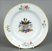 A 19th century Chinese Export dish The centre painted with an armorial. 18.5 cms diameter. Some gilt