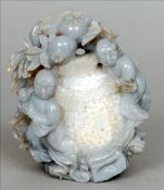 A Chinese carved agate figural group Formed as two young boys amongst rockwork and flowering