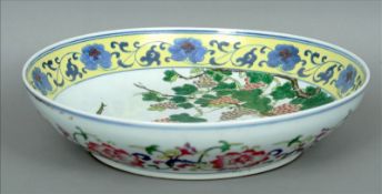 A late 19th/early 20th century Chinse porcelain charger The rim decorated with scrolling flowers