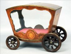 A 19th century marquetry inlaid rosewood vitrine Formed as a coach, the domed top with a band of