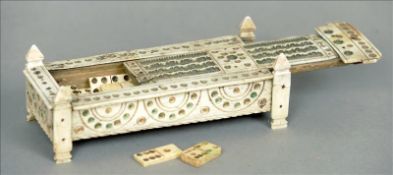 A set of early 19th century French prisoner of war dominoes Housed in a carved bone casket form