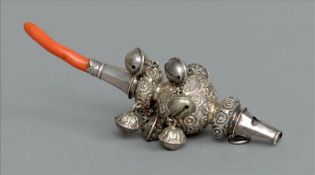 A Victorian silver baby’s rattle, hallmarked London, date and makers mark indistinct Hung with bells