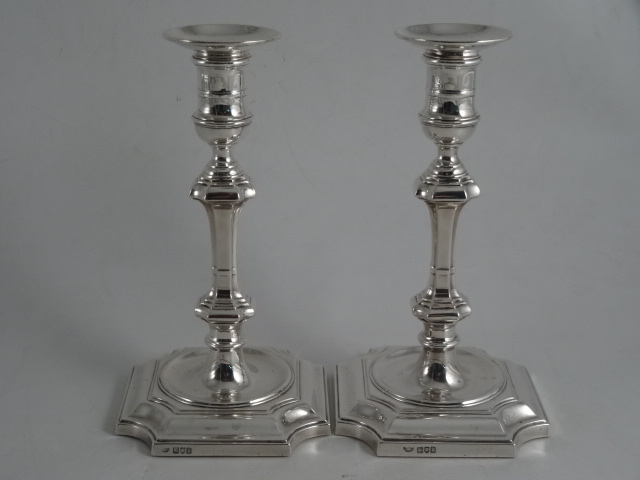 A PAIR OF GEORGE V SILVER TABLE CANDLESTICKS, London 1912, H & R Co. Ltd. Early Georgian style with