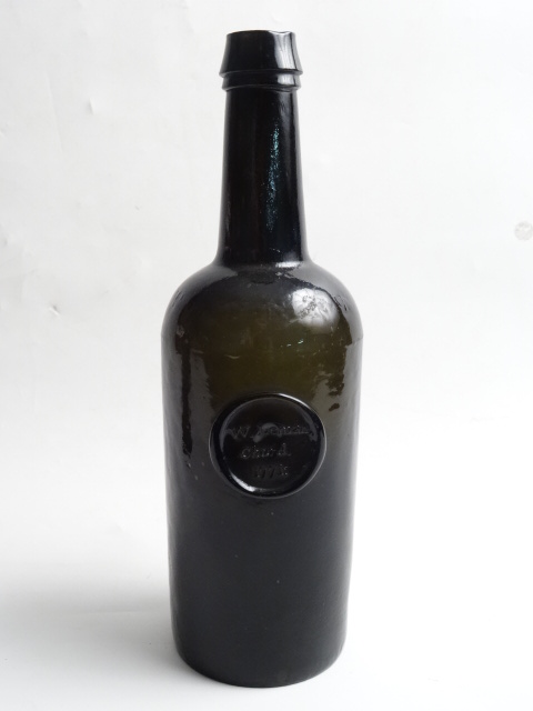 AN 18THC SEALED GREEN GLASS BOTTLE, ""W LEMAN, CHARD, 1771"". Supplied by H Ricketts & Co.,
