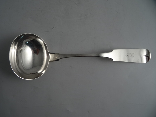 AN AMERICAN SILVER SOUP LADLE by Mitchell and Tyler. Fiddle pattern monogrammed RAH.   33cm. +/-