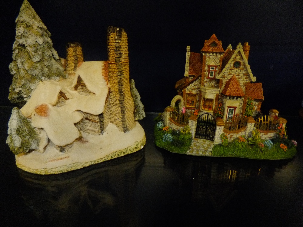 A David Winter Christmas cottage and a Leonardo cottage