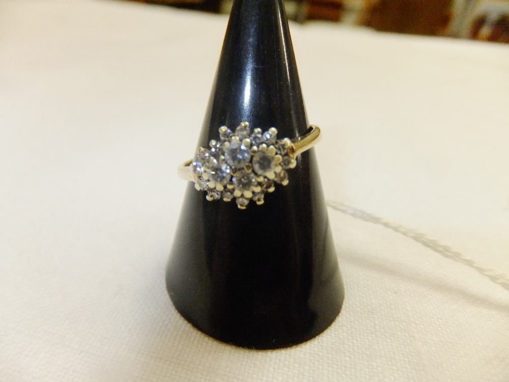 A 9ct gold cluster ring inset with approx 0.40p diamonds, size L