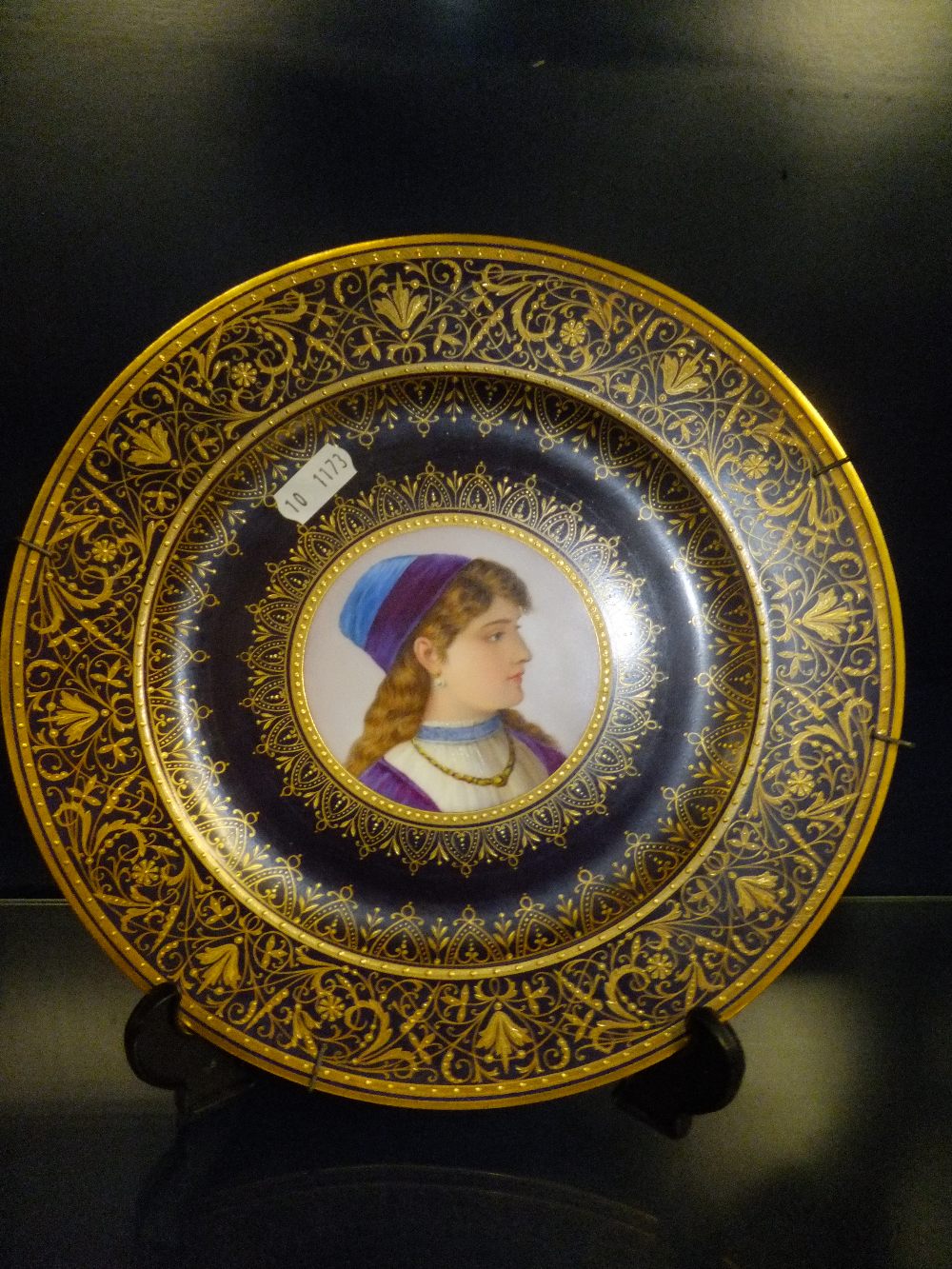 A Royal Vienna porcelain cabinet plate having cobalt blue and gilt decoration with central female