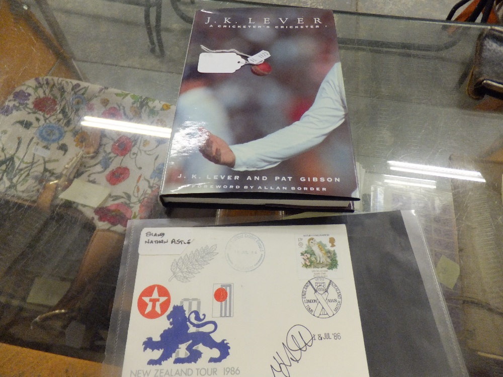 A cricket book signed by J.K LEVER and a First day cover of New Zealand tour 1986 signed by NATHAN