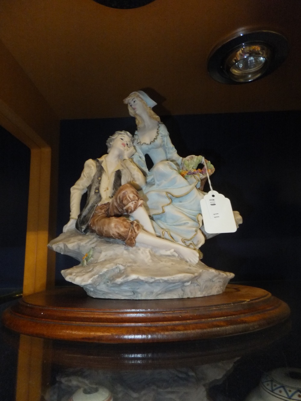 A Continental porcelain figure of a courting couple