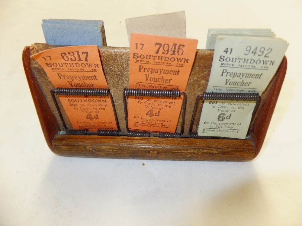 A quantity of Southdown prepayment vouchers for fares, and Isle of Man single fares in wooden stand