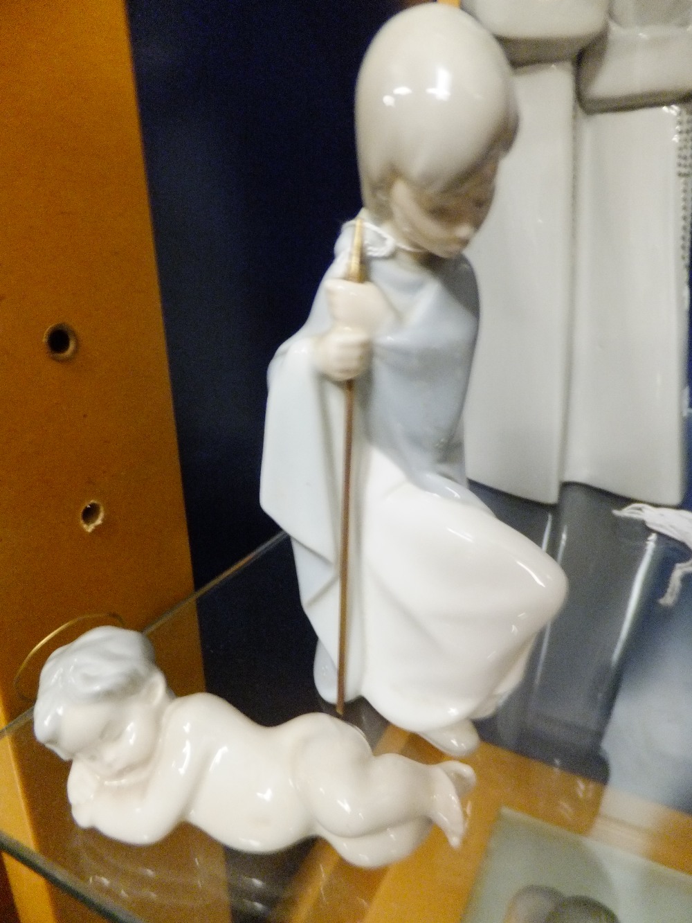 A Lladro figurine of a young girl with her stick and baby Jesus