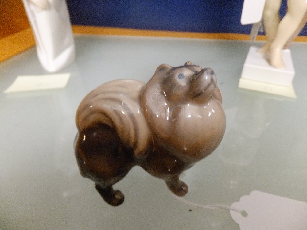 A Copenhagen figurine of a "Pomeranian", marks to base No 1148