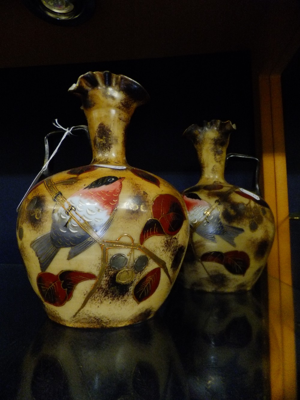 A pair of Victorian opaline fluted ewer's with bird and gilded decoration