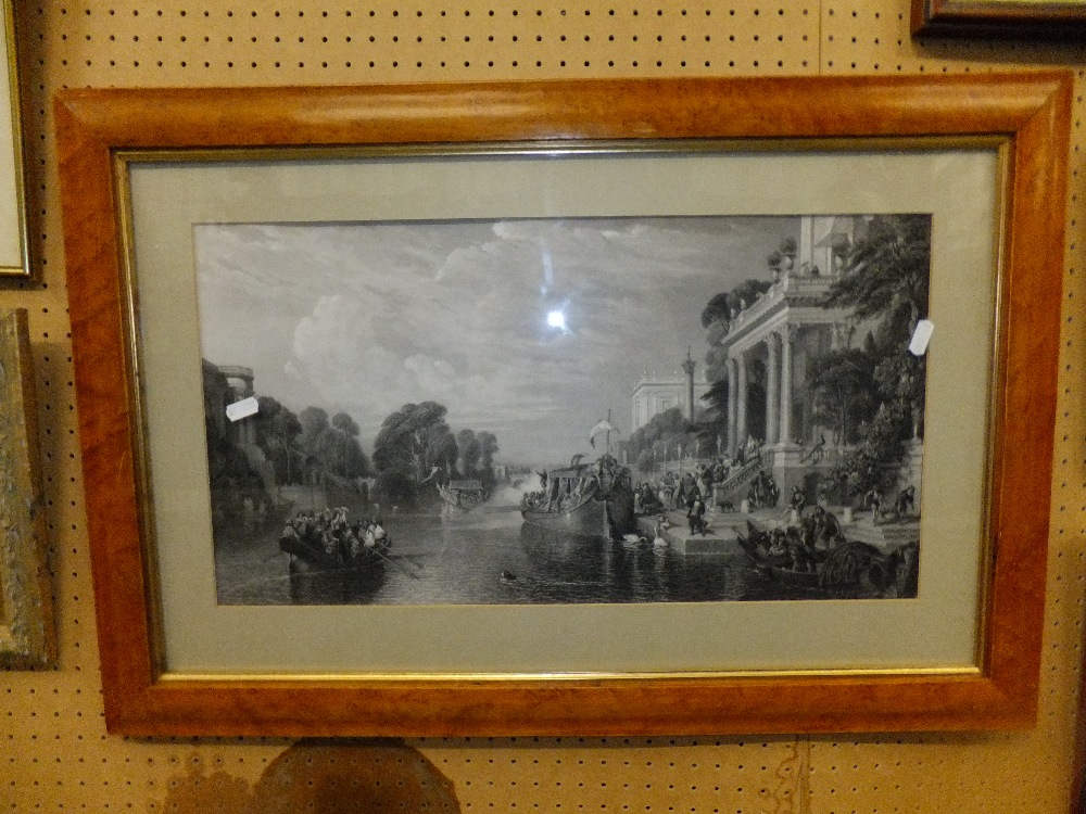 A large engraving in a walnut veneered frame