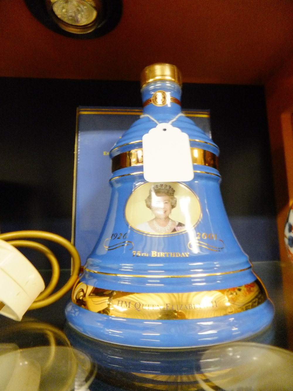 A boxed decanter of Bells Old Scotch Whiskey to commemorate the Queen's 70th Birthday