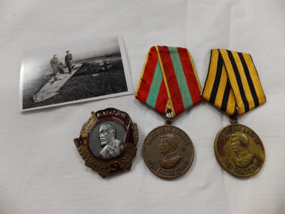 Three Russian medals to include replica order of Lenin and a photograph