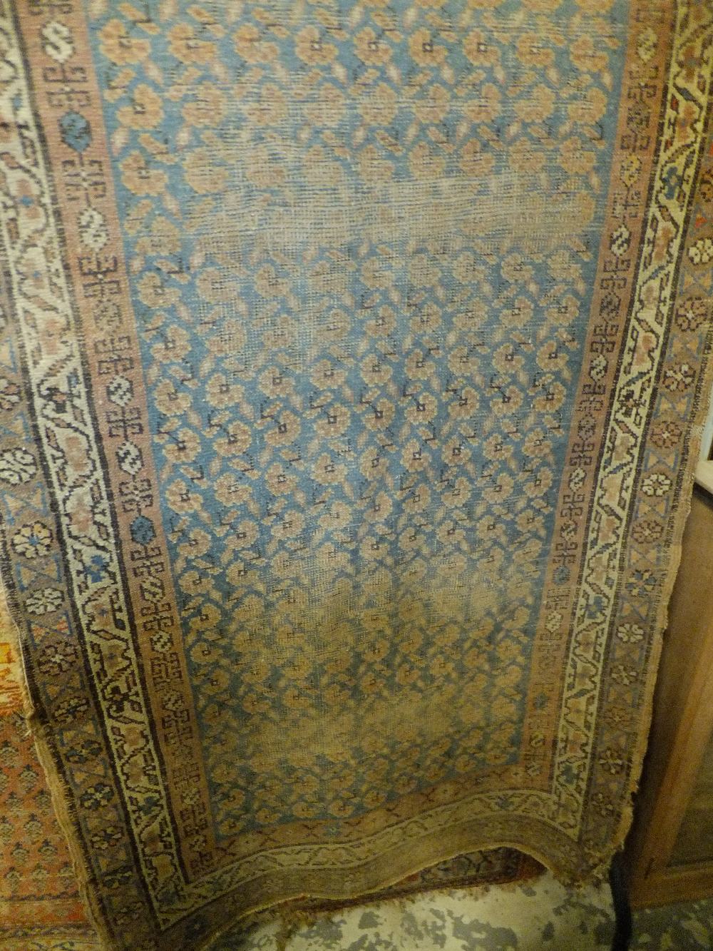 A blue ground hall runner with geometric pattern, 9ft 4" x 3ft 2"