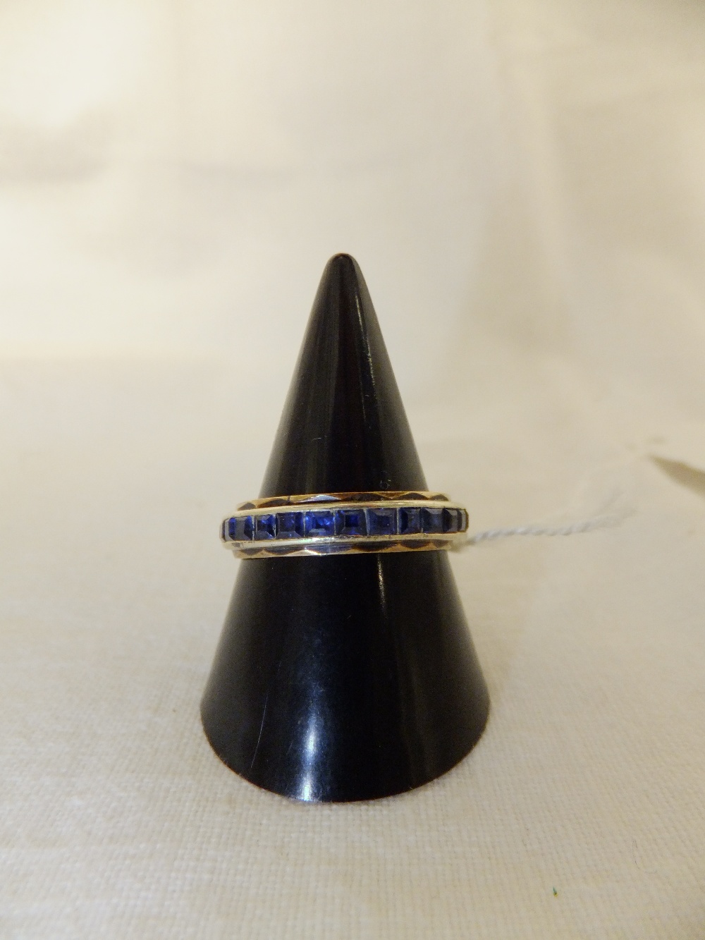 A sapphire set white and yellow metal ring, size Q