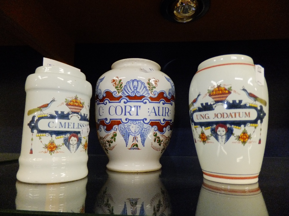 Three Delft apothecary jars