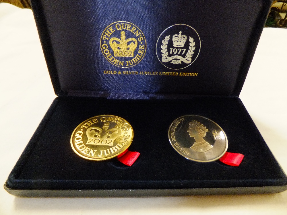 A cased set of two silver proof crowns, a 1977 Silver Jubilee crown and a 2002 Golden Jubilee crown