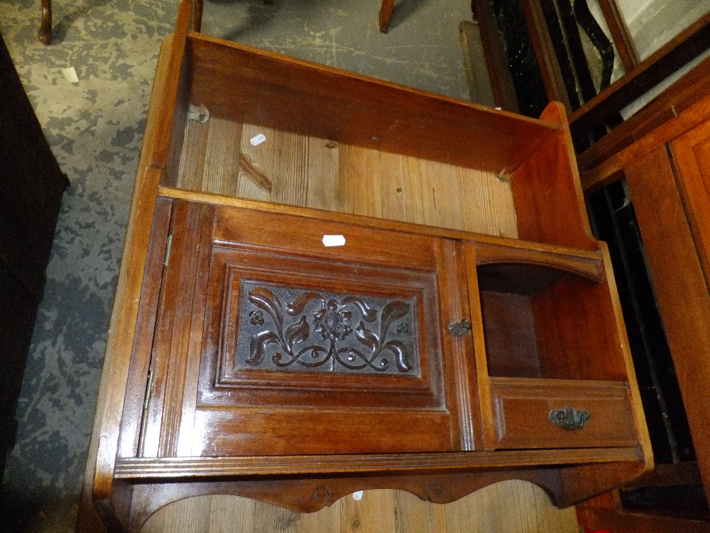 A mahogany hanging cabinet with shelf
