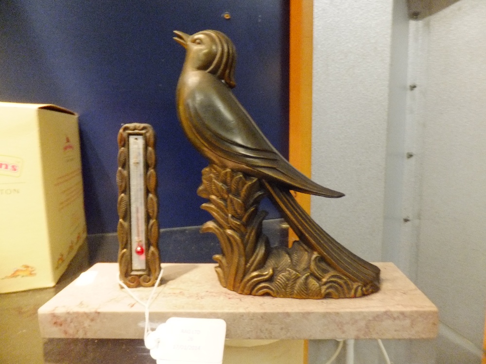 An Art Deco bronze bird thermometer on a marble base, signed A. H