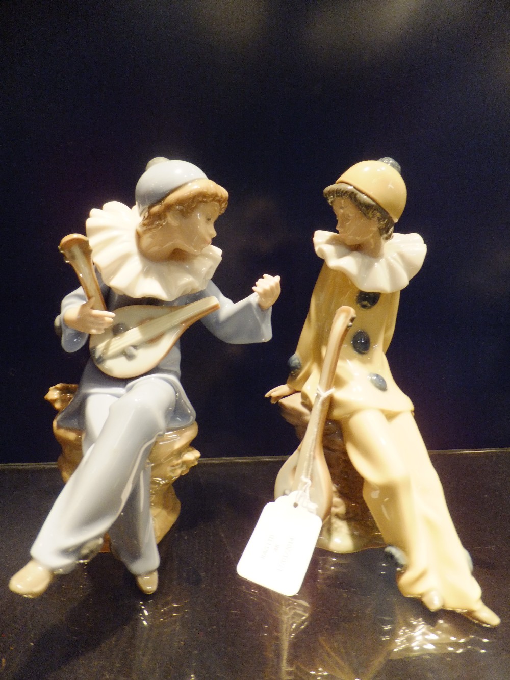 Two Nao figurines "Clowns strumming Mandolin's"