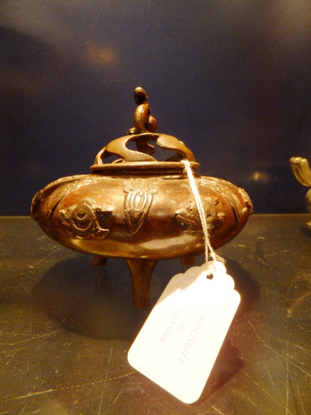 A Japanese bronze incense burner with applied decoration