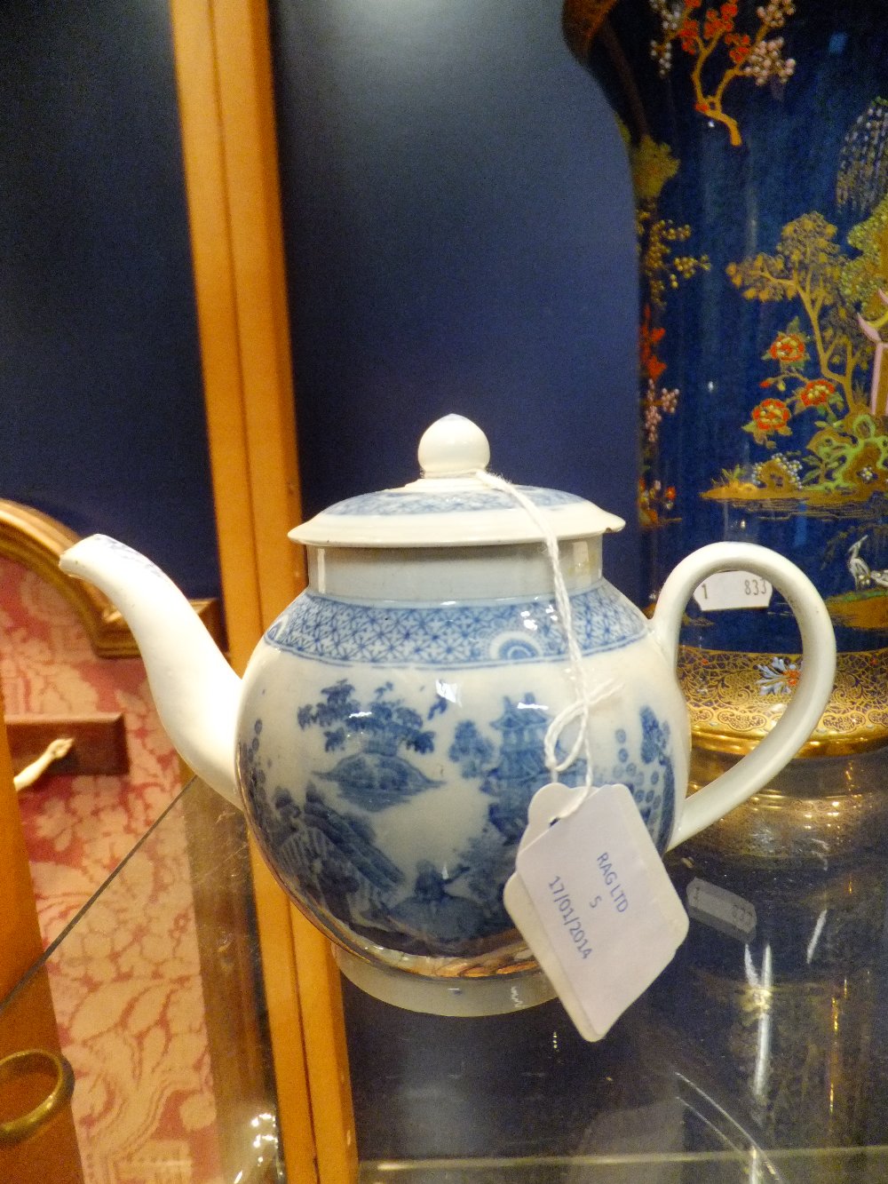 An early blue & white tea pot with pagoda and farm scene A/F