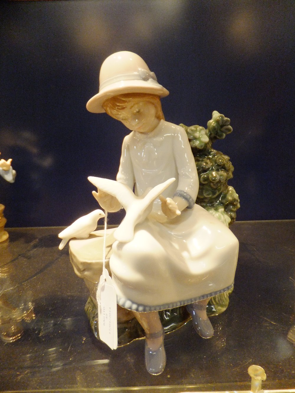 A Nao figurine "Girl with Bird"