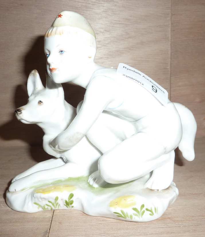 Russian ceramic figure of boy with Alsatian dog