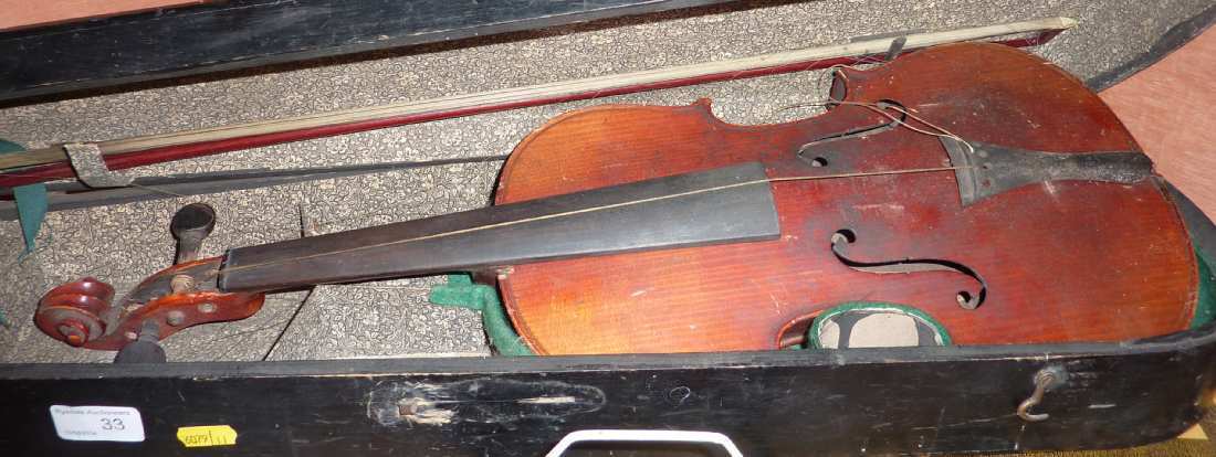 Cased violin & bow with paper label Antonius Stradiuarius Cremonans
