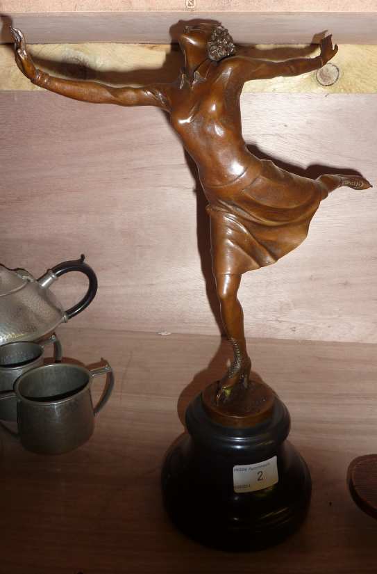 20thC bronze figure of a skating girl with signature to the base on turn marble column