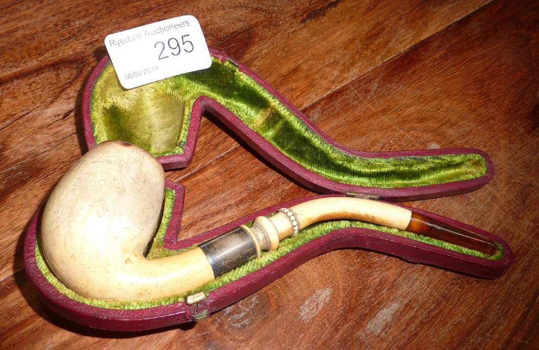 Cased vintage pipe with amber mouth piece