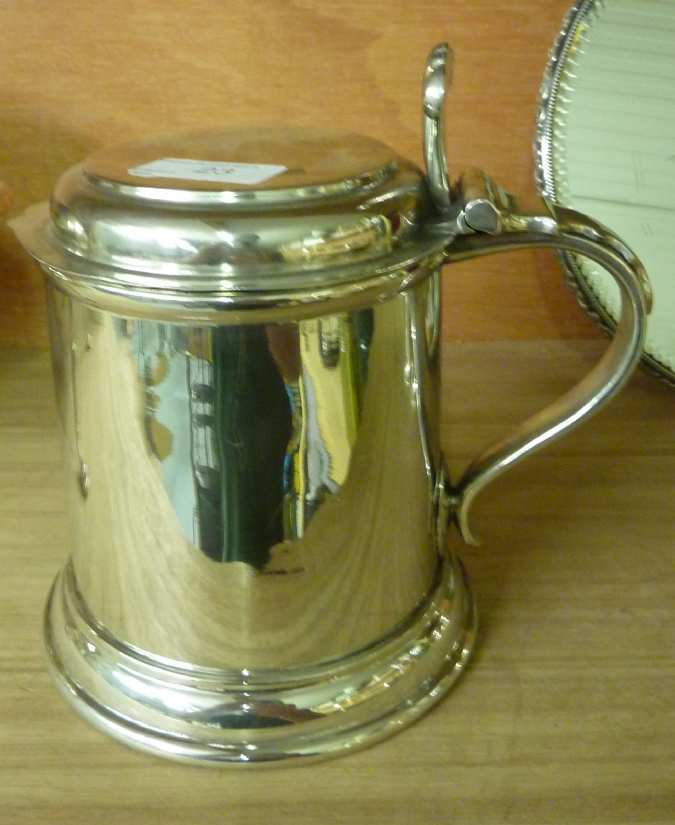 Polished pewter tankard with hinged top