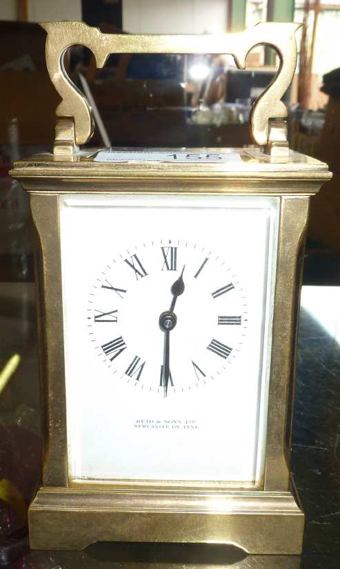 Brass cased carriage clock by Reid & Son Ltd Newcastle on Tyne