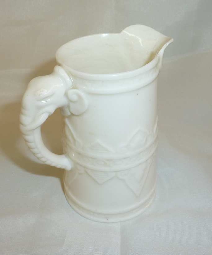 Royal Worcester cream jug in the Japanese style, the blanc de chine body with low relief moulded