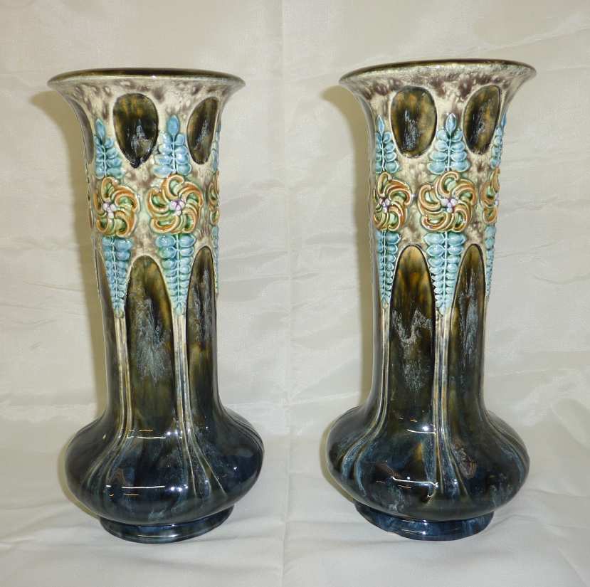 Pair of late Victorian green glazed vases with floral detail (27cm high)